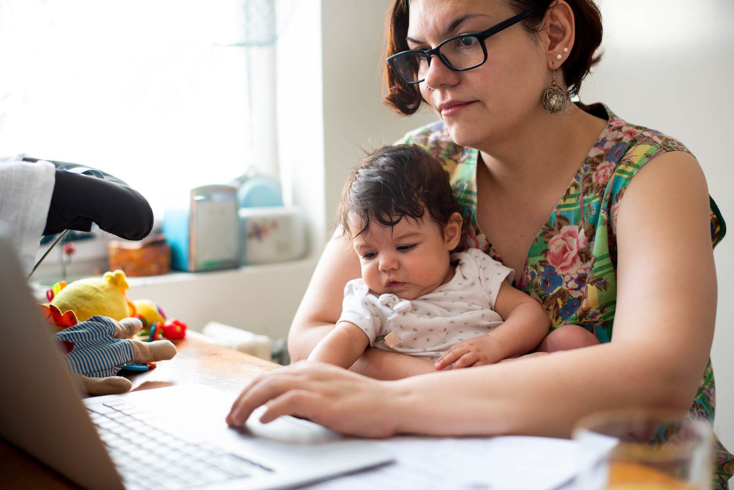 Working mom with baby in a lap